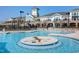 Inviting community pool with a unique center design, comfortable lounge chairs, and a view of the clubhouse at 1214 Gaston Manor Dr, Durham, NC 27703