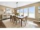 Dining room with a wooden table and seating for six with plenty of natural light at 1214 Gaston Manor Dr, Durham, NC 27703