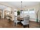 Cozy dining area featuring a round table, stylish chairs, and a modern chandelier at 1214 Gaston Manor Dr, Durham, NC 27703