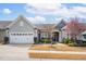 Charming home with a two-car garage and well-manicured landscaping at 1214 Gaston Manor Dr, Durham, NC 27703