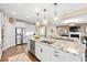 Spacious kitchen featuring a large island, granite countertops, stainless steel appliances, and seamless open layout at 1214 Gaston Manor Dr, Durham, NC 27703