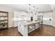 Stylish kitchen with white cabinets, granite countertops, a center island, and stainless steel appliances at 1214 Gaston Manor Dr, Durham, NC 27703