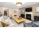 Inviting living room with comfortable seating, a fireplace, and a modern entertainment setup at 1214 Gaston Manor Dr, Durham, NC 27703