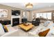Cozy living room featuring a fireplace, hardwood floors, stylish decor, and comfortable seating arrangements at 1214 Gaston Manor Dr, Durham, NC 27703