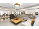 Bright living room with hardwood floors and open floor plan flows to the kitchen and dining area at 1214 Gaston Manor Dr, Durham, NC 27703