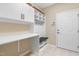 Well-organized mud room with built-in storage, cabinets, and drop zone at 1214 Gaston Manor Dr, Durham, NC 27703