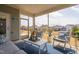 Relaxing screened porch features comfortable seating and views of the backyard and neighboring homes at 1214 Gaston Manor Dr, Durham, NC 27703
