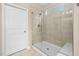 Clean shower with tiled walls, a glass door, and a built-in bench at 1214 Gaston Manor Dr, Durham, NC 27703