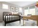 Bright bedroom with twin beds, neutral tones, and natural light, perfect for or guests at 1244 Hardin Hill Ln, Knightdale, NC 27545