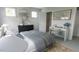 Bright bedroom featuring a comfortable bed, stylish desk, and ample natural light at 1244 Hardin Hill Ln, Knightdale, NC 27545