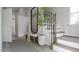Inviting foyer with staircase, bench, tree decor, and hardwood floors at 1244 Hardin Hill Ln, Knightdale, NC 27545