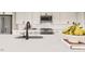 Stylish kitchen with white cabinets, a stainless steel appliance suite and a large island featuring a modern faucet at 1244 Hardin Hill Ln, Knightdale, NC 27545