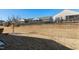 Spacious backyard with a retaining wall and view of neighboring homes at 1407 Palmer Hill Dr, Durham, NC 27703
