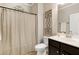 Cozy bathroom with decorative accents, a vanity, and a shower with a curtain at 1407 Palmer Hill Dr, Durham, NC 27703