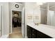 Bathroom with an open doorway to a walk-in closet, and a vanity with a mirror at 1407 Palmer Hill Dr, Durham, NC 27703
