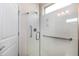 Modern bathroom featuring a glass-enclosed shower with grab bars and accessible fixtures at 1407 Palmer Hill Dr, Durham, NC 27703