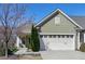 Charming home featuring an attached garage, well-maintained lawn, and inviting curb appeal at 1407 Palmer Hill Dr, Durham, NC 27703