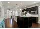 Modern kitchen boasts dark cabinets, stainless steel appliances, and a center island at 1407 Palmer Hill Dr, Durham, NC 27703