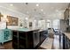 Spacious kitchen features a large center island with granite countertops and dark cabinets at 1407 Palmer Hill Dr, Durham, NC 27703