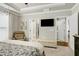 Relaxing bedroom featuring a ceiling fan, doorways to a walk-in closet and bathroom at 1407 Palmer Hill Dr, Durham, NC 27703