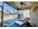 Inviting screened-in patio with ceiling fan and comfortable lounge chairs at 1407 Palmer Hill Dr, Durham, NC 27703