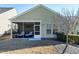 Relaxing screened porch with comfortable seating, perfect for enjoying the outdoors at 1407 Palmer Hill Dr, Durham, NC 27703
