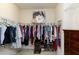 Spacious walk-in closet with ample shelving and hanging space, and a decorative mirror at 1407 Palmer Hill Dr, Durham, NC 27703