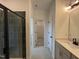 Modern bathroom featuring a tiled shower with a glass door and neutral wall paint at 1511 Malcus Ct # 64, Fuquay Varina, NC 27526