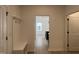 Hallway featuring coat rack and storage bench that leads to the kitchen and a bedroom at 1511 Malcus Ct # 64, Fuquay Varina, NC 27526