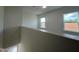 Well-lit upper hallway boasting new windows and a view of the development around the home at 1511 Malcus Ct # 64, Fuquay Varina, NC 27526