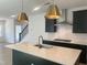 Modern kitchen island and fixtures compliment an open floor plan for entertaining at 1511 Malcus Ct # 64, Fuquay Varina, NC 27526
