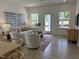 Open-concept living room featuring wood floors, neutral décor, and ample natural light at 1511 Malcus Ct # 64, Fuquay Varina, NC 27526