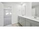Elegant bathroom featuring double vanity with white countertop and ample cabinet space at 153 Klamath Dr, Garner, NC 27529