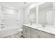 The bright bathroom features a double sink vanity, a bathtub, and recessed lighting at 153 Klamath Dr, Garner, NC 27529