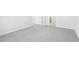 Neutral bedroom featuring gray carpeting, white trim and view of a neighboring room at 153 Klamath Dr, Garner, NC 27529