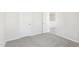Simple bedroom featuring plush carpeting, white trim and two white doors at 153 Klamath Dr, Garner, NC 27529