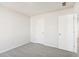 Small bedroom featuring plush carpeting, white walls, and a single window at 153 Klamath Dr, Garner, NC 27529