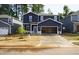 Charming two-story home with a spacious two-car garage and a well-manicured front yard at 153 Klamath Dr, Garner, NC 27529