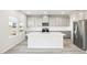 Stylish kitchen with stainless steel appliances, an island, and lots of cabinets at 153 Klamath Dr, Garner, NC 27529
