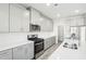 Modern kitchen with grey cabinets, stainless steel appliances and island at 153 Klamath Dr, Garner, NC 27529