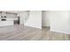 Spacious living room with hardwood floors flowing into the kitchen area at 153 Klamath Dr, Garner, NC 27529