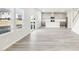 Bright, open living room featuring hardwood floors and an open kitchen at 153 Klamath Dr, Garner, NC 27529