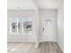 Bright living room with hardwood floors, natural light and white walls at 153 Klamath Dr, Garner, NC 27529