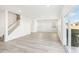 Bright, open-concept living room with hardwood floors and natural light at 153 Klamath Dr, Garner, NC 27529