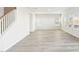 Bright, airy living space with sleek flooring, large windows, and a modern staircase at 153 Klamath Dr, Garner, NC 27529