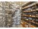 Unique stone wine cellar with wooden shelving, rustic charm, and a place to store your collection at 1532 Champlain Crest Way, Cary, NC 27513