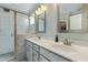 Modern bathroom with double sinks, granite countertops, a glass-enclosed shower, and neutral tones at 169 Black Cloud Dr, Louisburg, NC 27549