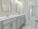 Elegant bathroom featuring dual sinks, modern fixtures, and ample counter space at 169 Black Cloud Dr, Louisburg, NC 27549
