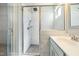 Modern bathroom featuring a glass shower, decorative tiling, updated fixtures, and a sink at 169 Black Cloud Dr, Louisburg, NC 27549