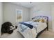 Comfortable bedroom with natural light and a whimsical decor at 169 Black Cloud Dr, Louisburg, NC 27549